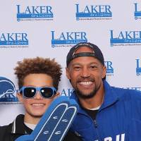 Father and son smiling